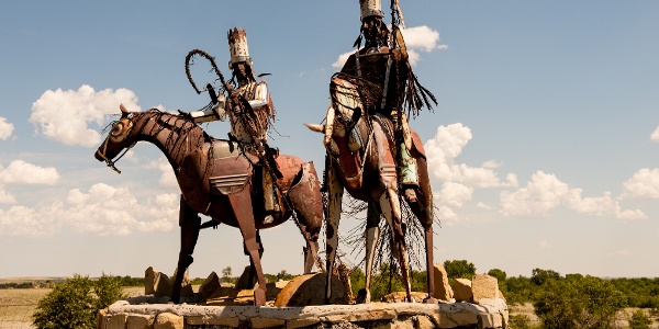 Iron sculpture of two Indians on horses